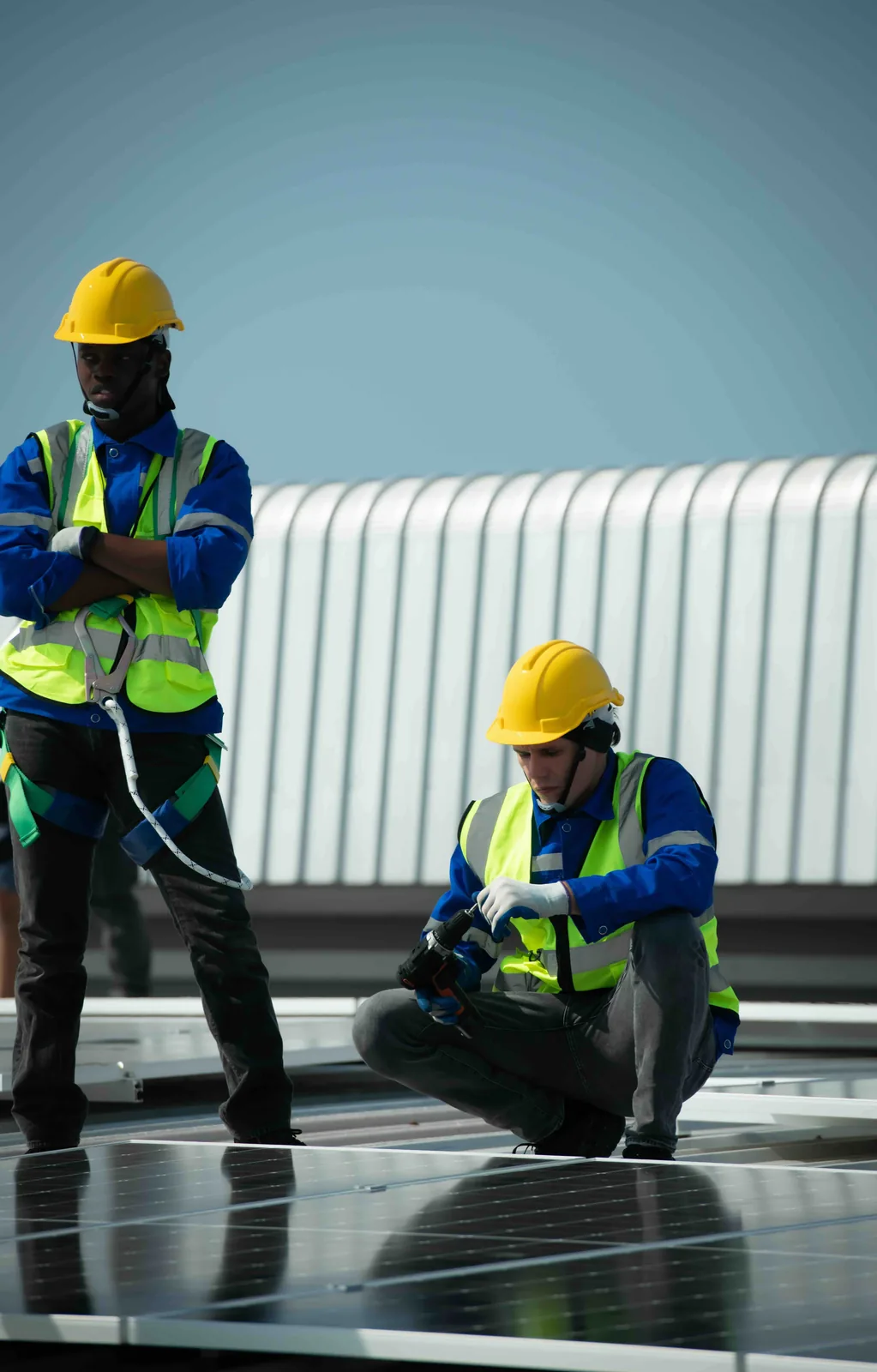 Roofing professionals working on a commercial roof