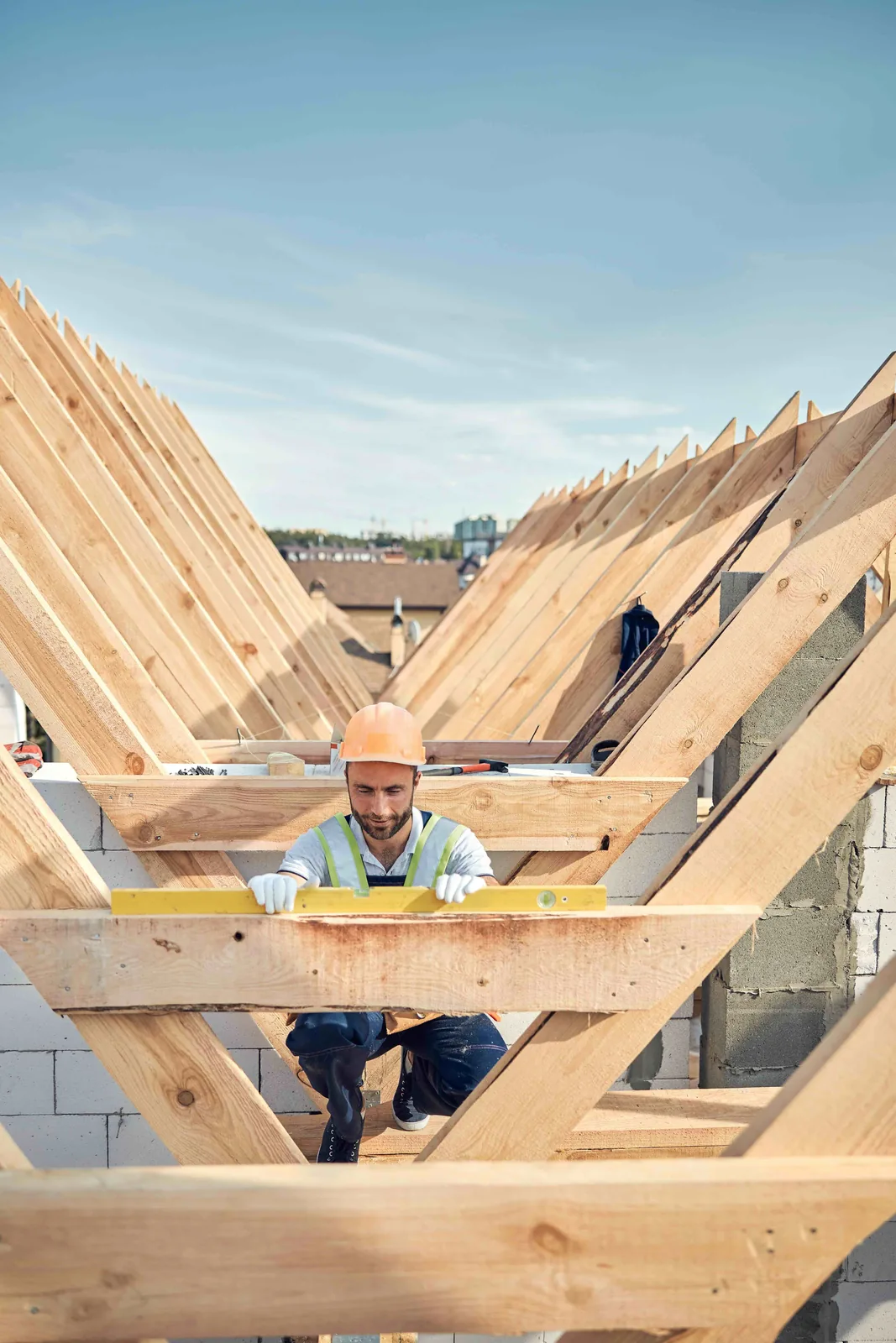 Construction professional working in roof framing